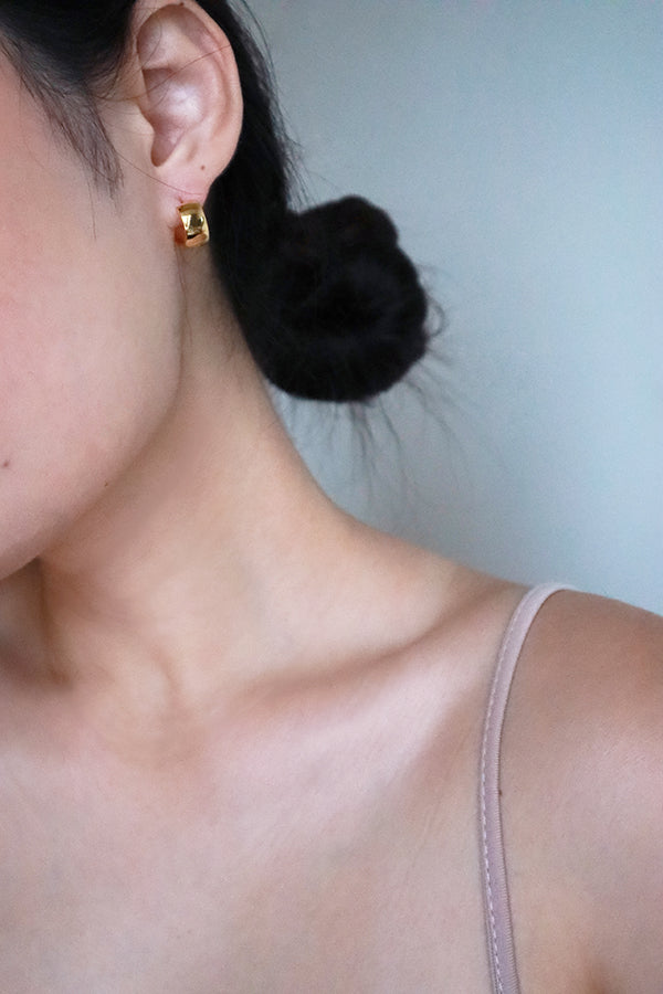 Woman wearing tarnish free everyday gold earrings