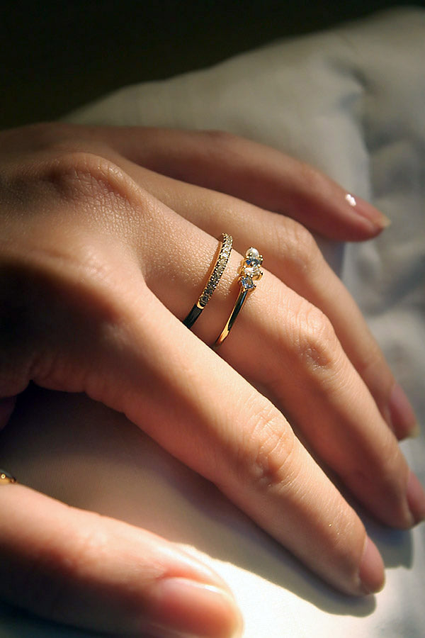 Zircon slim ring stacked with other gold ring by SH & Co.