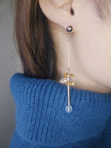 Close up shot of handmade yellow crystal link earrings