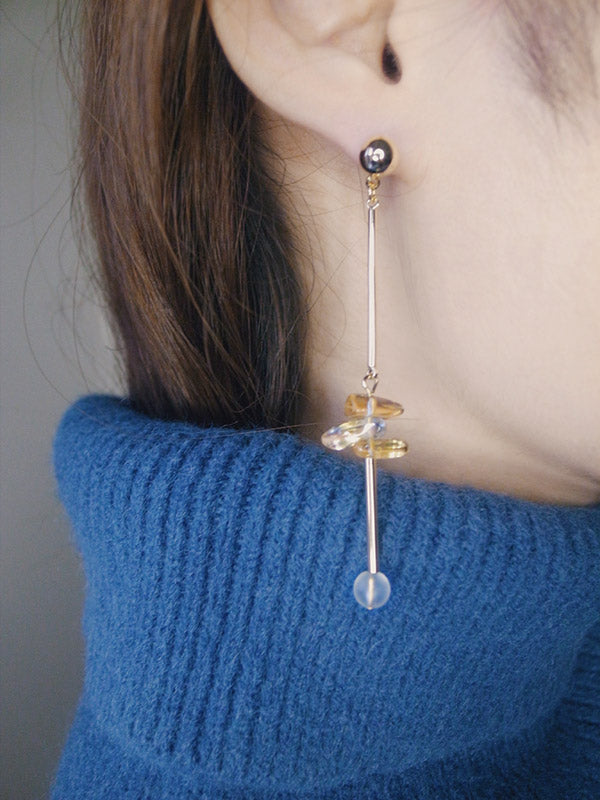 Close up shot of handmade yellow crystal link earrings