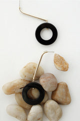A onyx circle drop earrings on stones