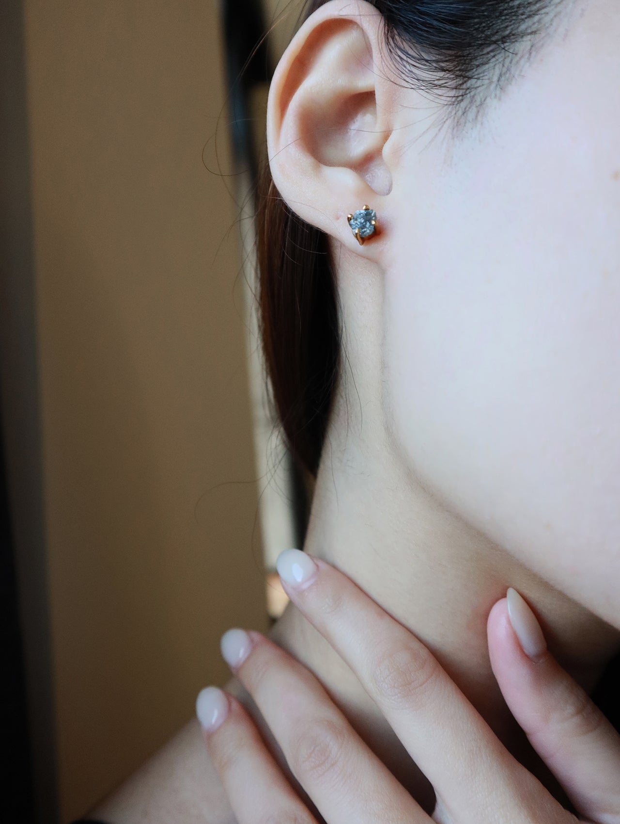 Model showing her ear with high quality handmade earrings