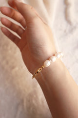 Woman wearing a freshwater pearl made bracelet