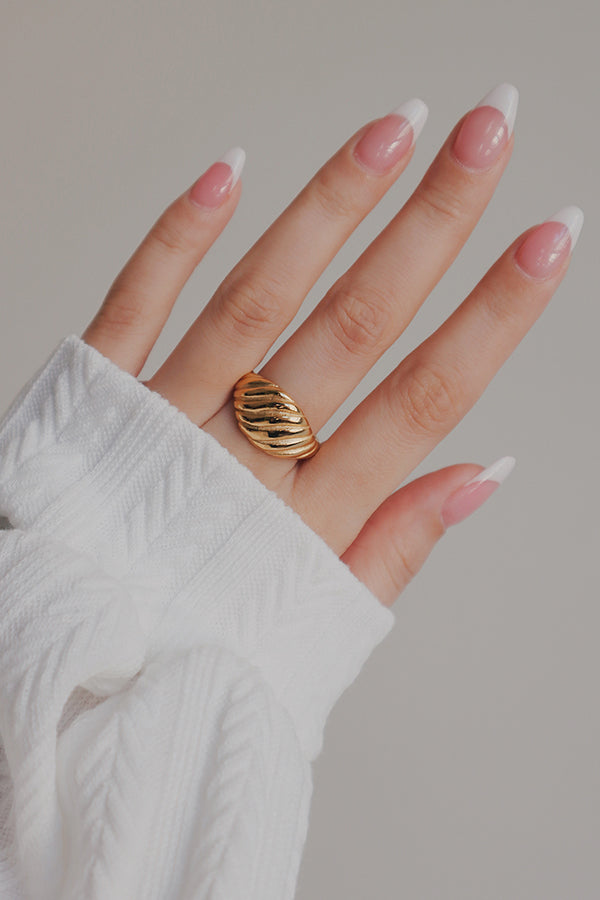 Woman wearing gold ring for wedding outfit