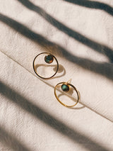 Studded circle stone hoops under sunlight from USA