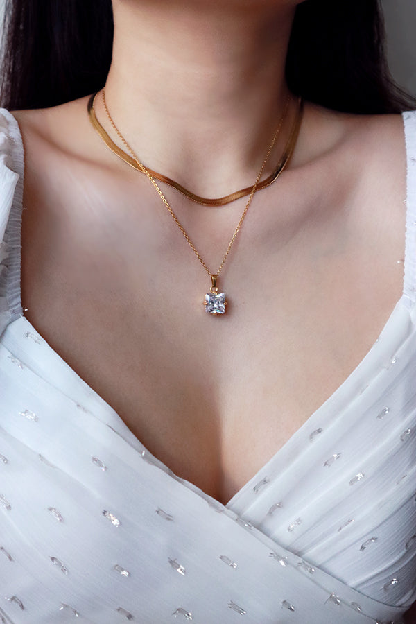 Trendy gold snake necklace in the jewelry box