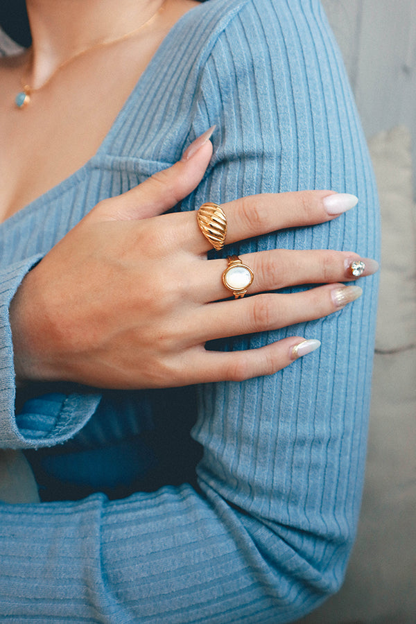 Woman shows her ring stacking ideas to the camera