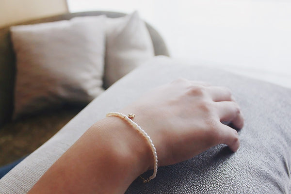 Zircon and pearl bracelet under sunlight