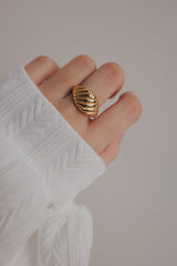 Model showing trendy croissant gold plated ring