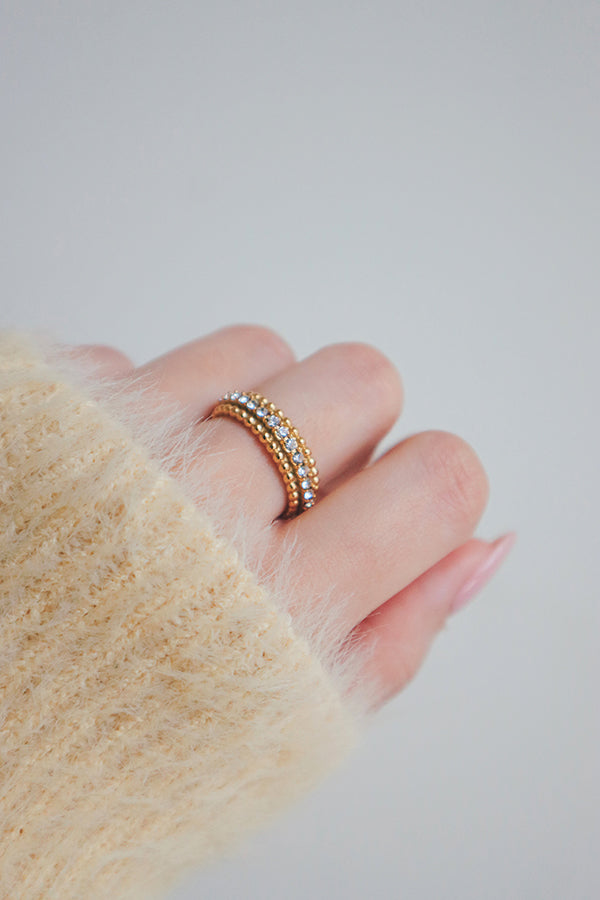 Eye-catching, gold-plated ring with glistening cubic zirconia accents for a luxurious appearance.
