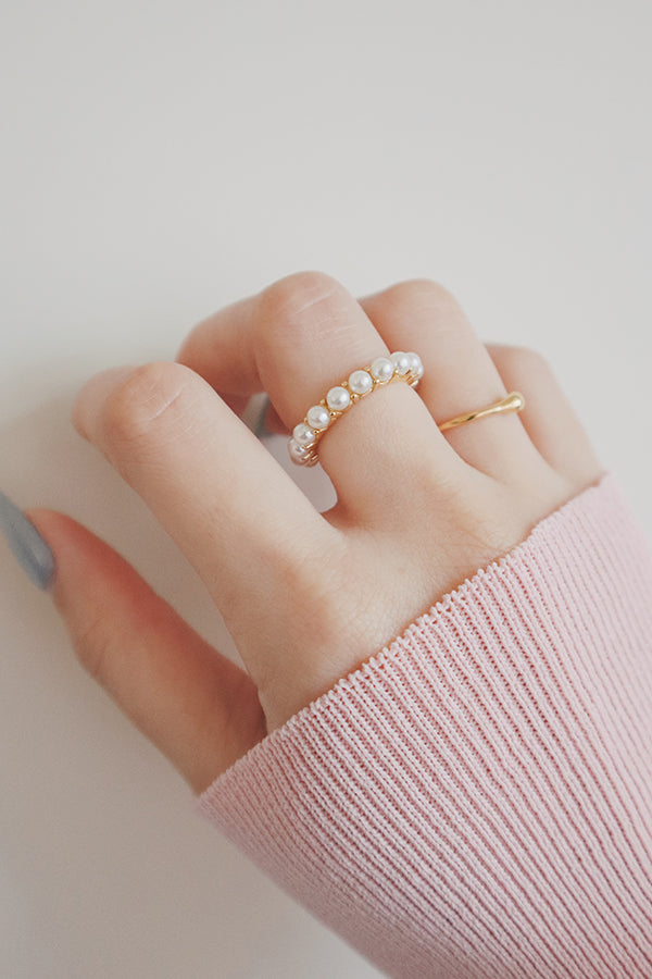 Model shows how to stack gold rings