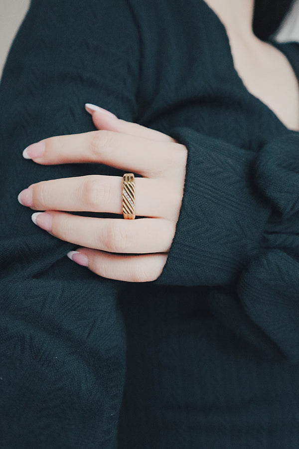 Model wearing a fashion style gold ring for her cool outfit