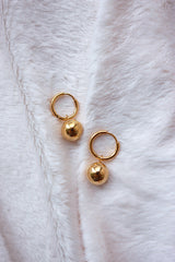 High quality stainless steel plated with 18k gold water proof earrings on the white blanket