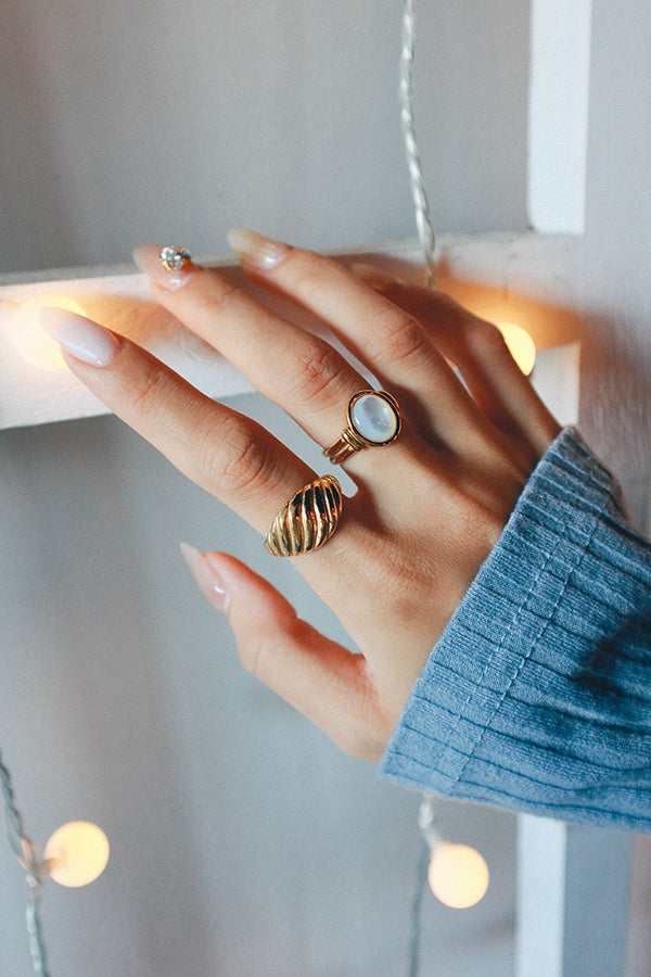 Woman trends elegant gold plated jewelry for stacking look