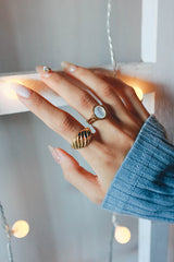 Woman trends elegant gold plated jewelry for stacking look